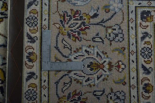 Backside of handmade 2000s Kashan rug showing knot structure and weave density