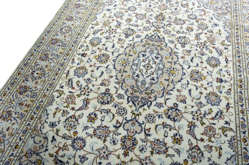 Backside of handmade 2000s Kashan rug showing knot structure and weave density