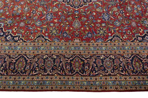 Corner detail of 2000s Kashan rug showing border pattern and Cork pile