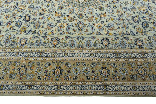 Corner detail of 2000s Kashan rug showing border pattern and Wool pile