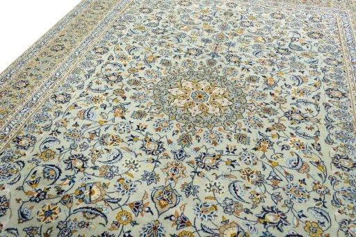 Backside of handmade 2000s Kashan rug showing knot structure and weave density