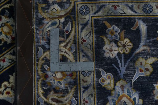 Surface texture of 2000s Kashan rug with natural Wool and intricate pattern