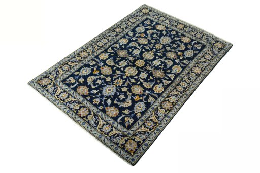 Corner detail of 2000s Kashan rug showing border pattern and Wool pile