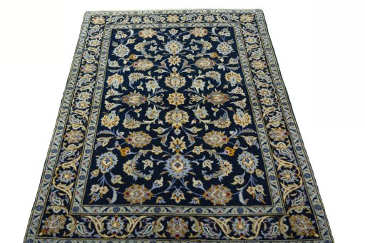 Surface texture of 2000s Kashan rug with natural Wool and intricate pattern
