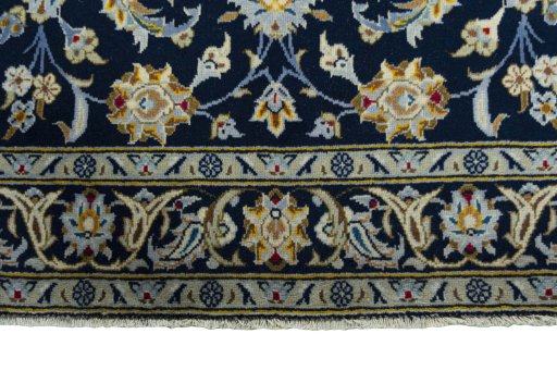 Close-up detail of 2000s Kashan rug from Iran / Persia showing Wool weave