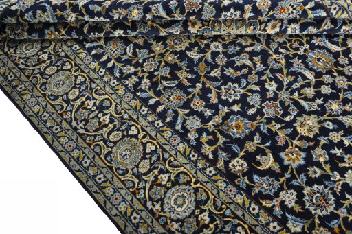 Close-up detail of 2000s Kashan rug from Iran / Persia showing Wool weave