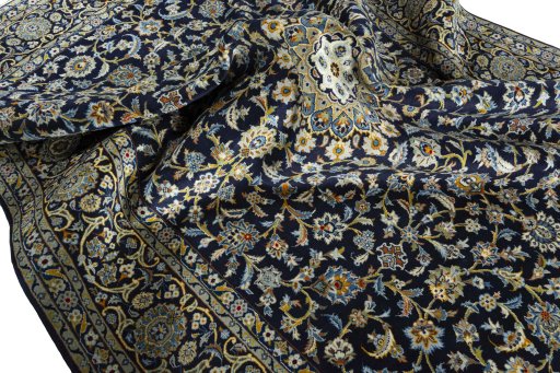 Surface texture of 2000s Kashan rug with natural Wool and intricate pattern