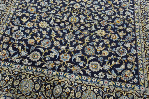 Close-up detail of 2000s Kashan rug from Iran / Persia showing Wool weave