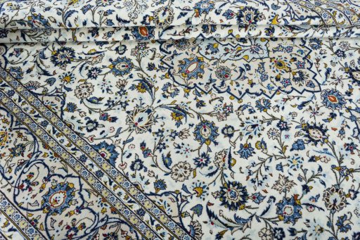 Close-up detail of 2000s Kashan rug from Iran / Persia showing Wool weave