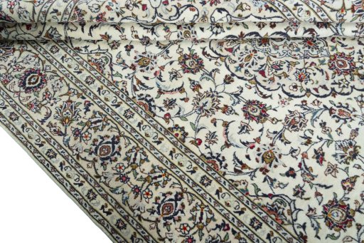 Close-up detail of 2000s Kashan rug from Iran / Persia showing Wool weave