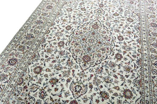 Backside of handmade 2000s Kashan rug showing knot structure and weave density