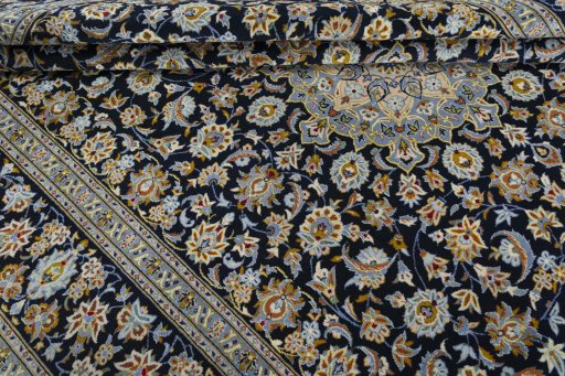 Close-up detail of 2000s Kashan rug from Iran / Persia showing Wool weave