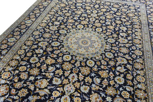 Backside of handmade 2000s Kashan rug showing knot structure and weave density