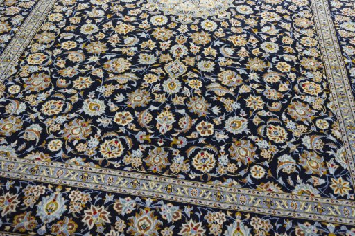 Close-up detail of 2000s Kashan rug from Iran / Persia showing Wool weave
