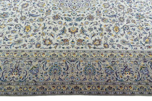Corner detail of 2000s Kashan rug showing border pattern and Wool pile