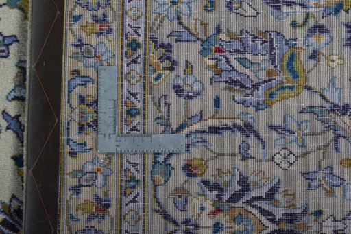 Backside of handmade 2000s Kashan rug showing knot structure and weave density