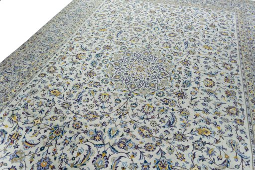 Backside of handmade 2000s Kashan rug showing knot structure and weave density