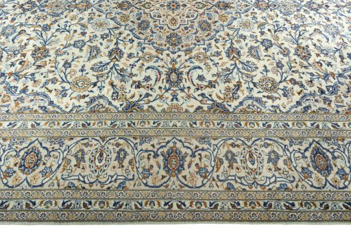 Corner detail of 2000s Kashan rug showing border pattern and Wool pile