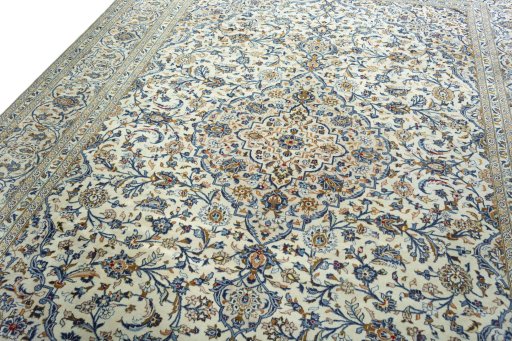 Backside of handmade 2000s Kashan rug showing knot structure and weave density