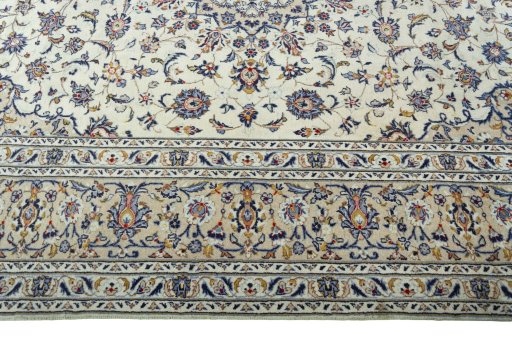 Corner detail of 2000s Kashan rug showing border pattern and Wool pile