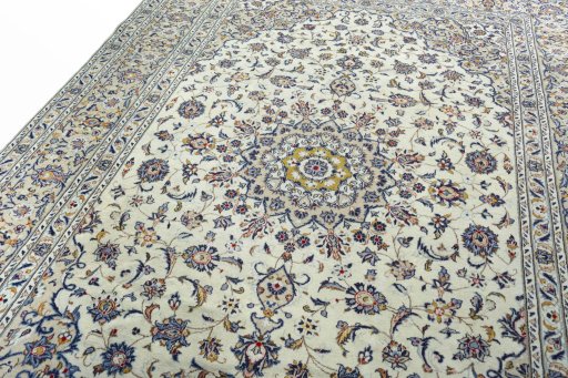 Backside of handmade 2000s Kashan rug showing knot structure and weave density