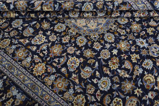 Close-up detail of 2000s Kashan rug from Iran / Persia showing Wool weave