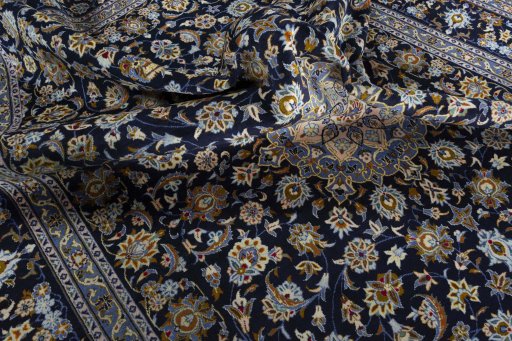 Surface texture of 2000s Kashan rug with natural Wool and intricate pattern