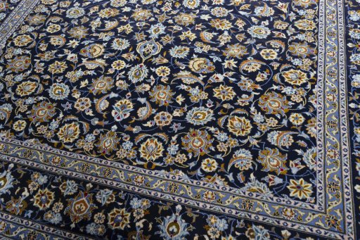 Close-up detail of 2000s Kashan rug from Iran / Persia showing Wool weave