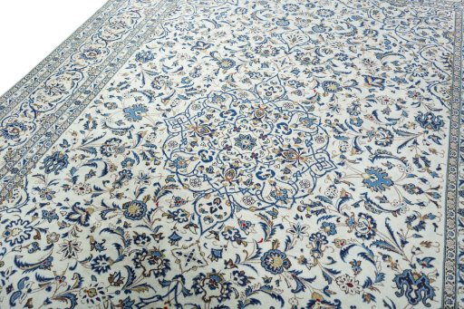Backside of handmade 2000s Kashan rug showing knot structure and weave density