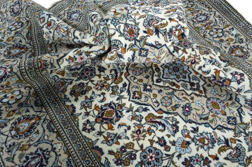 Surface texture of 2000s Kashan rug with natural Wool and intricate pattern