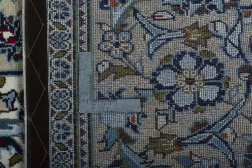 Backside of handmade 2000s Kashan rug showing knot structure and weave density