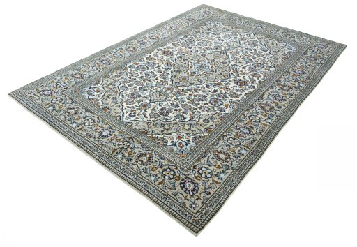 Corner detail of 2000s Kashan rug showing border pattern and Wool pile