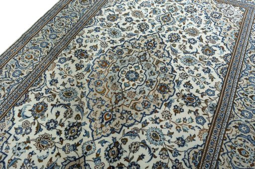 Backside of handmade 2000s Kashan rug showing knot structure and weave density