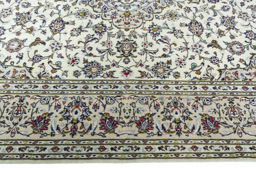 Corner detail of 2000s Kashan rug showing border pattern and Wool pile