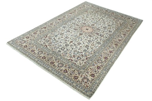 Corner detail of 2000s Kashan rug showing border pattern and Wool pile