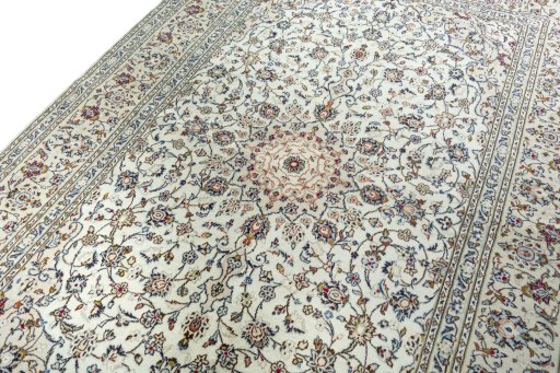 Backside of handmade 2000s Kashan rug showing knot structure and weave density
