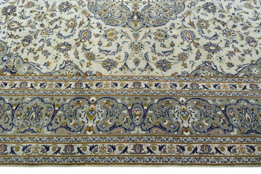 Corner detail of 2000s Kashan rug showing border pattern and Wool pile