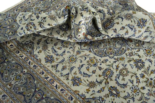 Surface texture of 2000s Kashan rug with natural Wool and intricate pattern