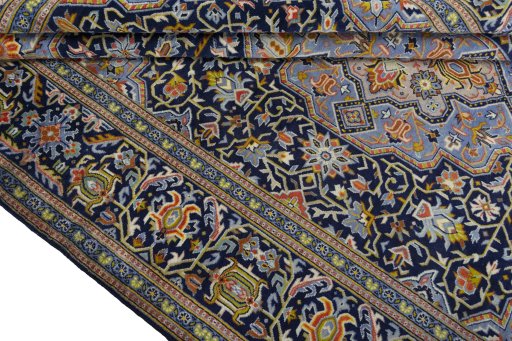Close-up detail of 2000s Kashan rug from Iran / Persia showing Wool weave