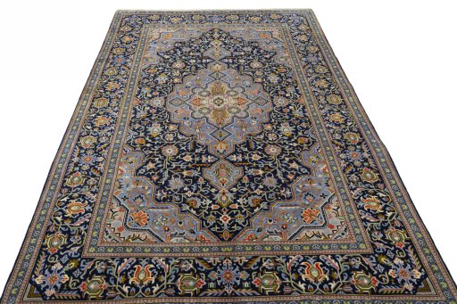 Surface texture of 2000s Kashan rug with natural Wool and intricate pattern