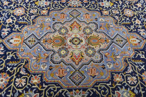 Central medallion detail of 2000s Kashan rug from Iran / Persia