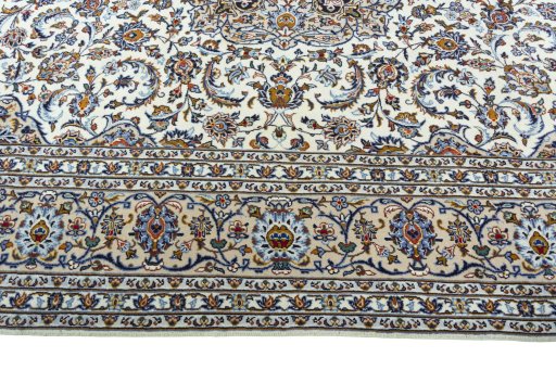 Corner detail of 2000s Kashan rug showing border pattern and Wool pile