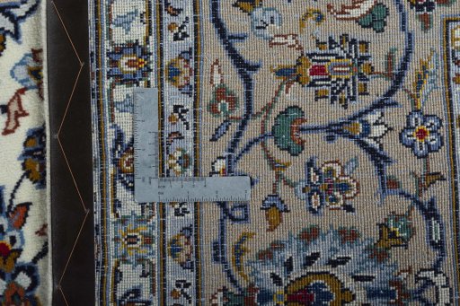 Backside of handmade 2000s Kashan rug showing knot structure and weave density