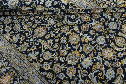 Close-up detail of 2000s Kashan rug from Iran / Persia showing Wool weave