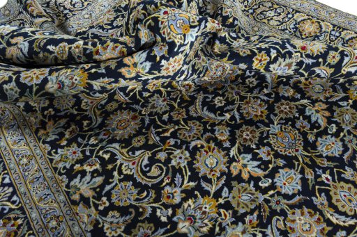Surface texture of 2000s Kashan rug with natural Wool and intricate pattern