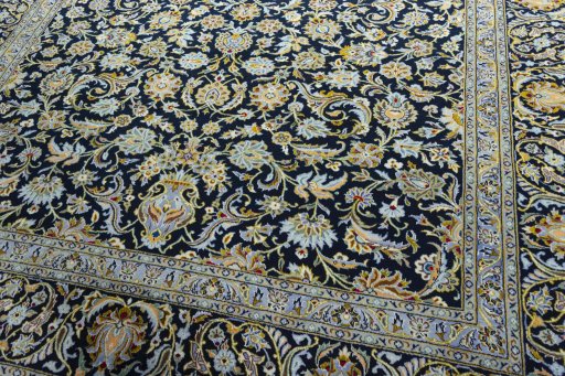 Close-up detail of 2000s Kashan rug from Iran / Persia showing Wool weave