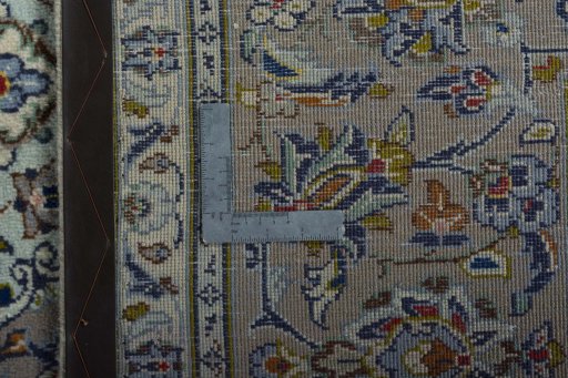 Backside of handmade 2000s Kashan rug showing knot structure and weave density