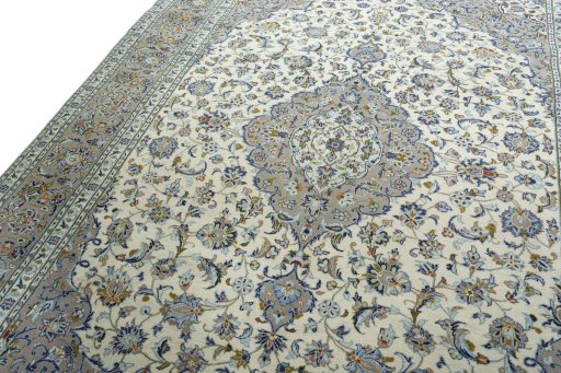 Backside of handmade 2000s Kashan rug showing knot structure and weave density