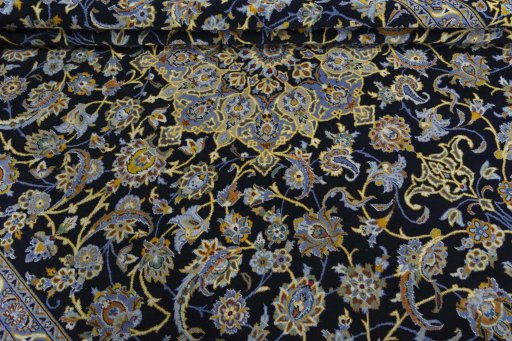 Close-up detail of 2000s Kashan rug from Iran / Persia showing Wool weave