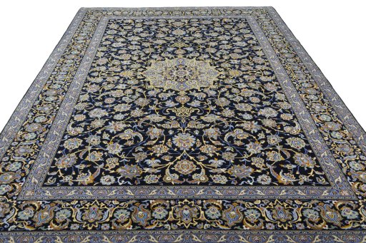 Surface texture of 2000s Kashan rug with natural Wool and intricate pattern